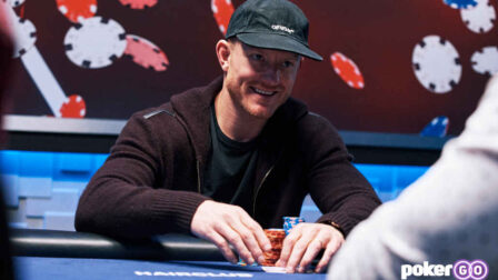 Jason Koon smiling at a high-stakes poker table