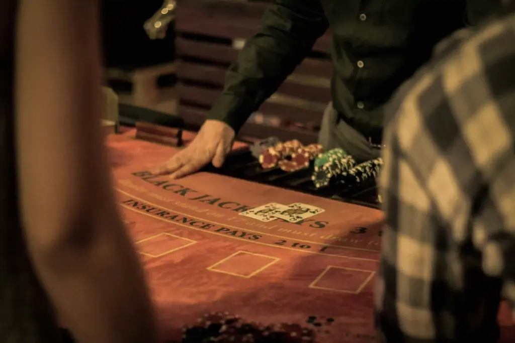 Dealer at a traditional blackjack table in a casino