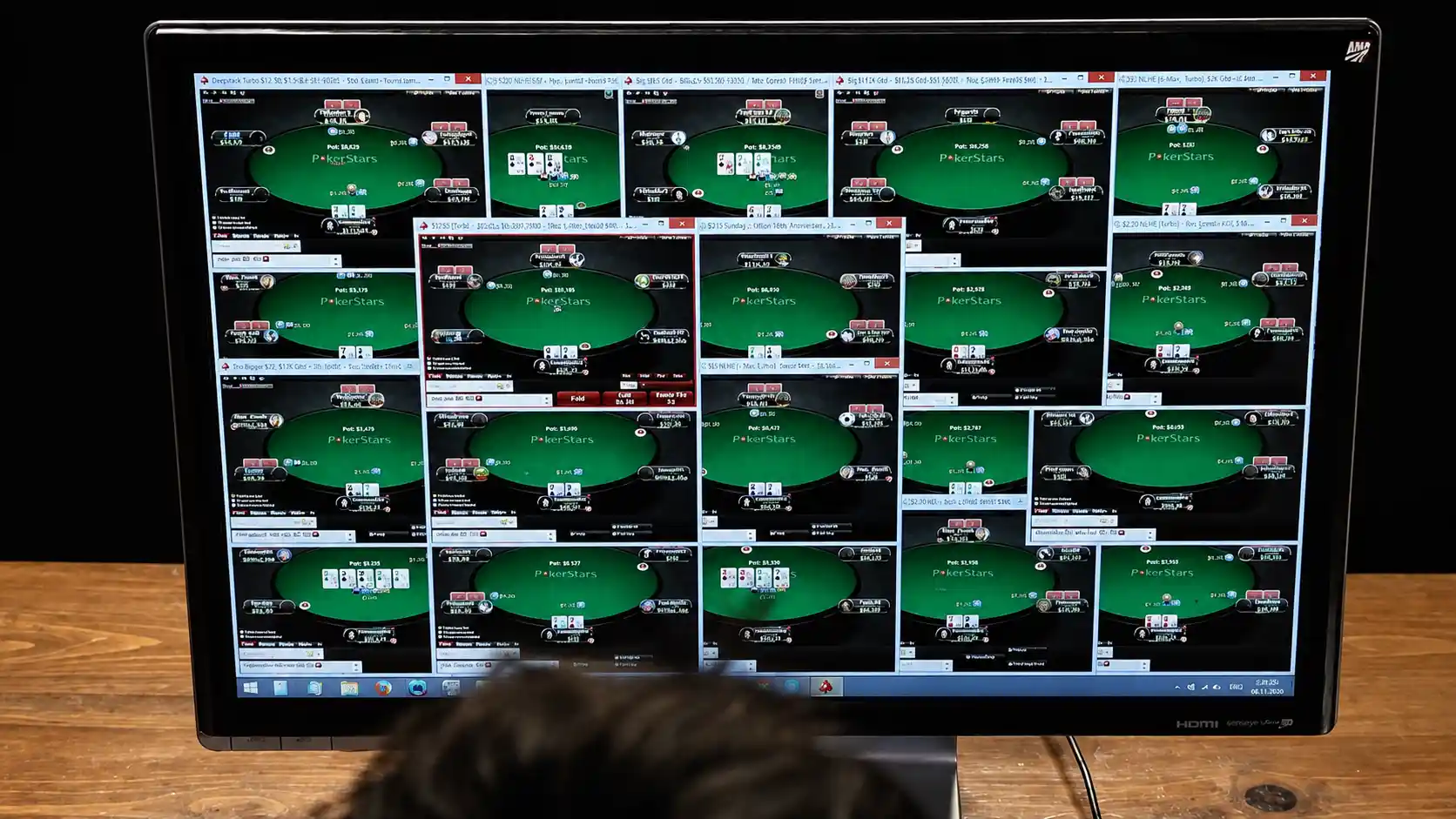 Professional poker player Randy "nanonoko" Lew mass multi-tabling 24 online poker tables on a single monitor.
