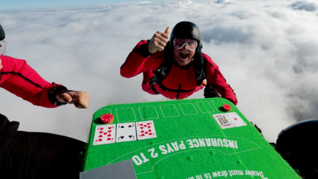 Professional skydivers playing blackjack at 13,000 feet during a Ladbrokes Speed Blackjack promotional stunt